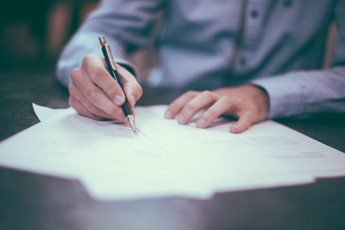 Senior counsel reviewing case documents at a desk